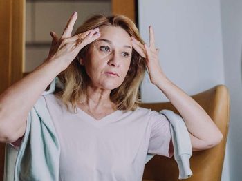 woman touching face