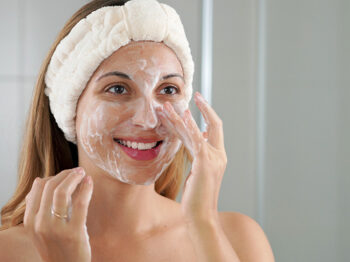 Woman washing her face
