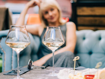 Woman sitting and white wine