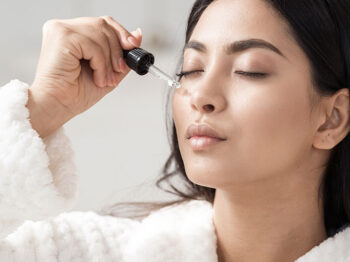 woman applying serum
