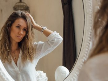 girl looking into mirror