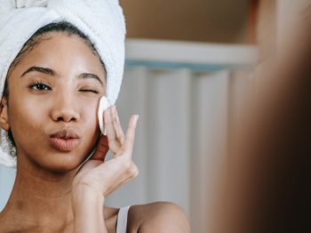 woman looking in mirror