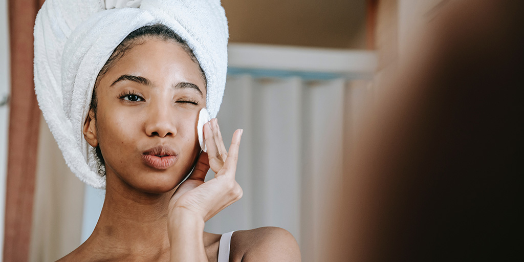 woman looking in mirror