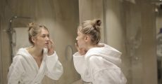 girl looking into mirror