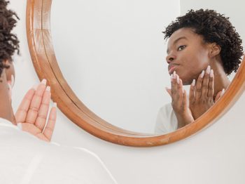 woman looking in mirror