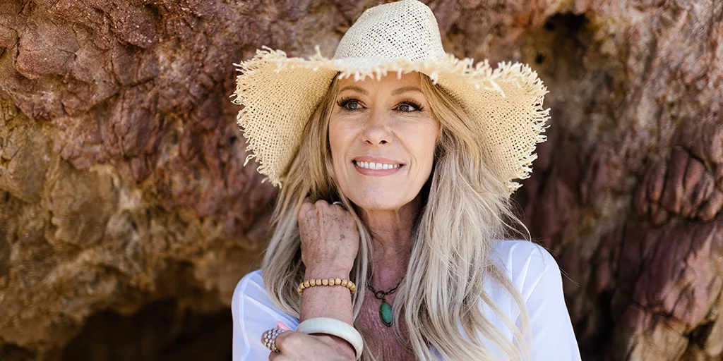 Woman smiling in a straw hat