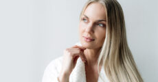 Woman with blonde hair thinking