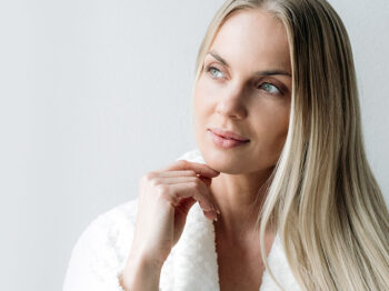 Woman with blonde hair thinking