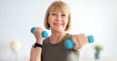 Woman lifting dumb bell weights