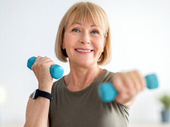 Woman lifting dumb bell weights